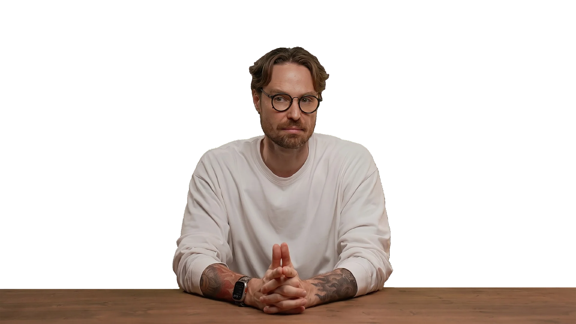 Presenter at a desk in front of the green screen